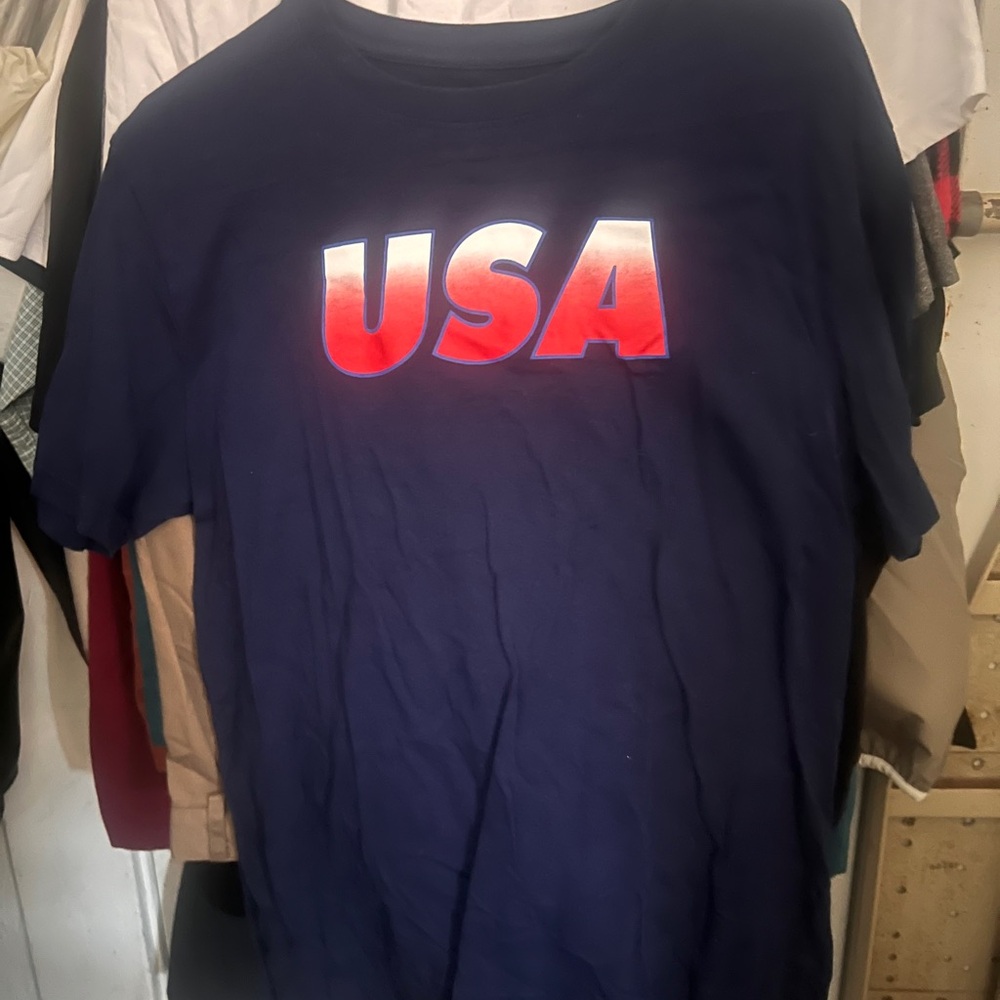 A blue men t shirt Lg/XLg red white and blue letters